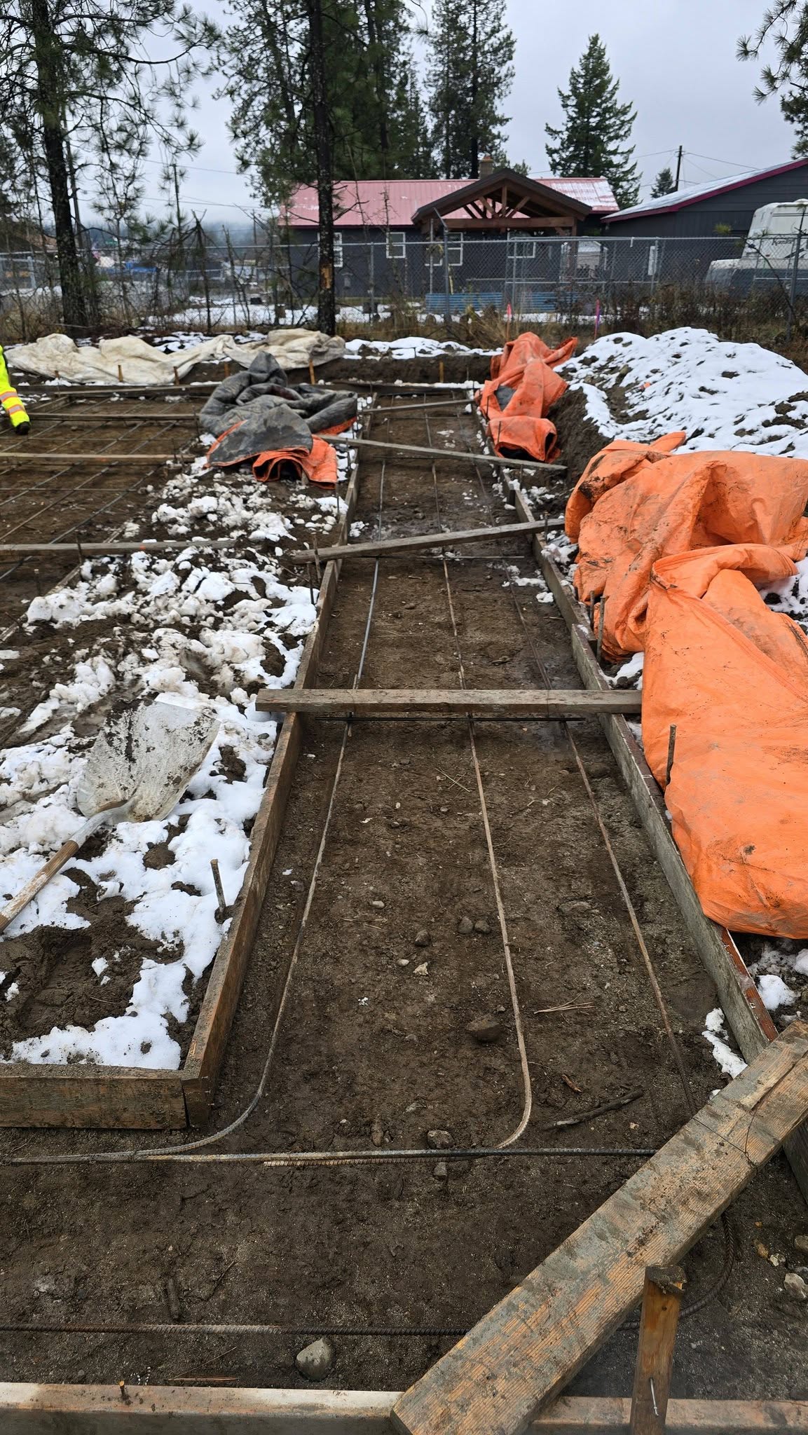 Concrete foundation forms and rebar in progress